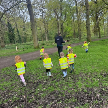 kids in hivis walking in woods
